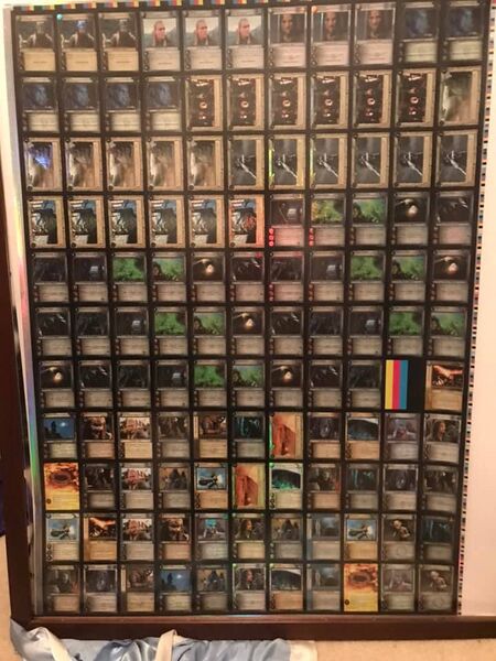 Uncut Rare Foil sheet for The Hunters. The bottom contains the 9 Legends Masterworks cards and two copies of the 18 Legends Rare Foils. The rest of the sheet above the spacer contains Gimli, Eager Hunter (0P123)￼START_WIDGET"'-f1f0a6b18a8441c3END_WIDGET, Legolas, Fleet-footed Hunter (0P124)￼START_WIDGET"'-36c0f38d64675e61END_WIDGET, Aragorn, Swift Hunter (0P125)￼START_WIDGET"'-afb2dc0ef77168ddEND_WIDGET, Lurtz, Now Perfected (0P126)￼START_WIDGET"'-6ad3e0a5d038ddebEND_WIDGET, Breeding pit of Isengard (0D9)￼START_WIDGET"'-63a8d8c1d327bf8eEND_WIDGET, City of Kings (0D10)￼START_WIDGET"'-e2202a964e223726END_WIDGET, Pinnacle of Zirakzigil (0D11)￼START_WIDGET"'-94781ef3f2a7accdEND_WIDGET, The Prancing Pony (0D12)￼START_WIDGET"'-2b07929dd66d4f8dEND_WIDGET, and six copies of set 16 The Wraith Collection.